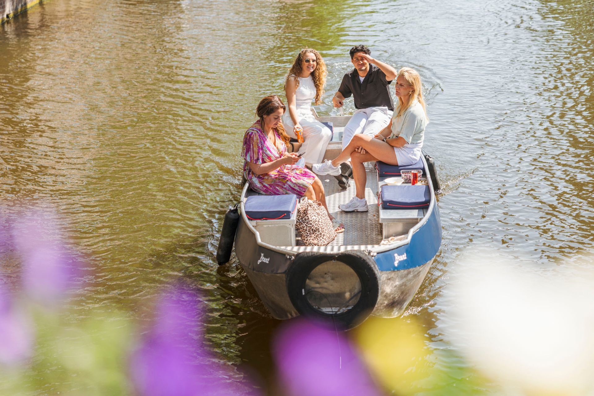 Friends enjoying a boat together in Amsterdam